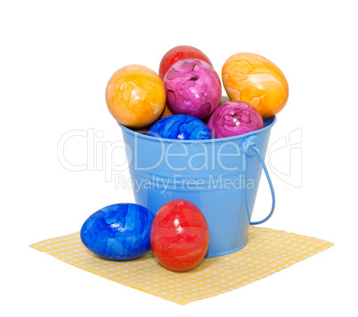Easter eggs in a bucket on a white background