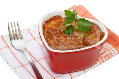 Meat baked in a pot on a white background