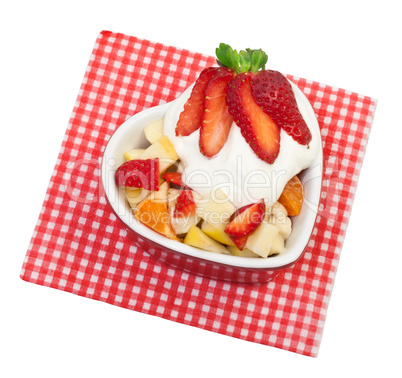 Fresh fruit salad with strawberries on a white background