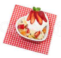 Fresh fruit salad with strawberries on a white background
