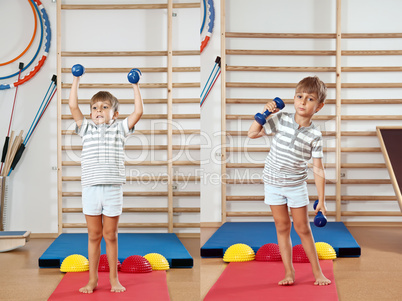 A boy with a dumbbell in the gym.