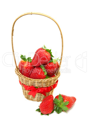 Fresh, ripe strawberries in a basket on a white background