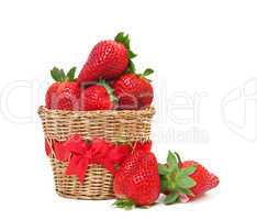 Fresh, ripe strawberries in a basket on a white background