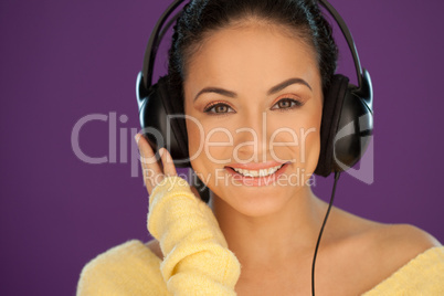 Beautiful brunette listening to music