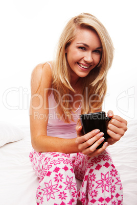 Smiling woman drinking morning coffee