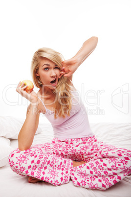 Woman with apple yawning