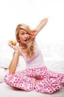 Woman with apple yawning