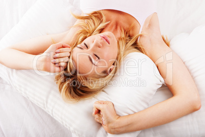 Sleepy woman stretching her arms