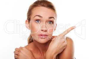 Surprised woman pointing her finger