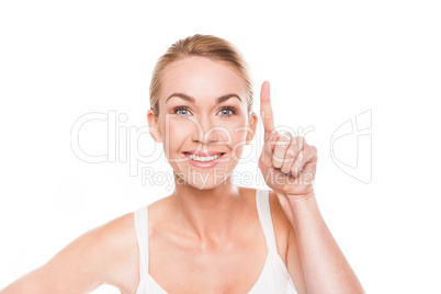 Smiling woman pointing with her finger