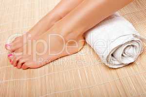 Womans feet with a rolled towel