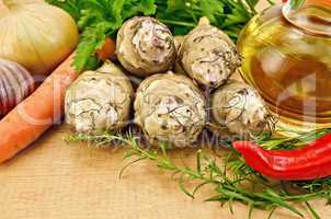 Jerusalem artichokes with vegetables on the board