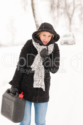 Woman walking with gas can winter car