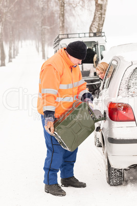 Man filling woman car gas winter assistance