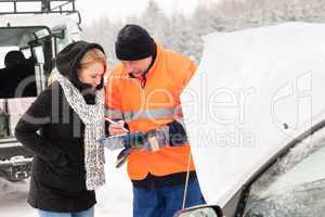 Woman fill document broken car snow mechanic