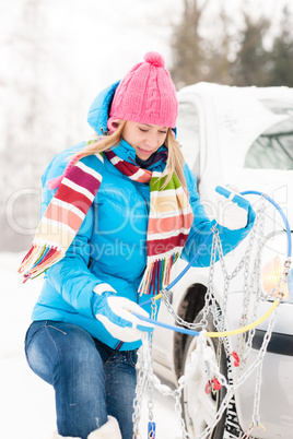Winter car tire snow chains woman