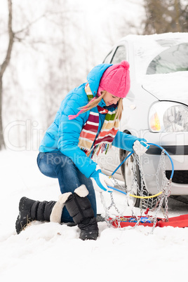 Winter car tire snow chains woman