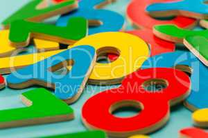 Colored wooden numbers and letters for children