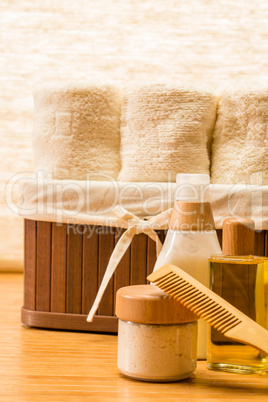 Natural cosmetic products with basket of towels