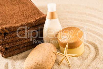 Spa beauty treatment products on sand