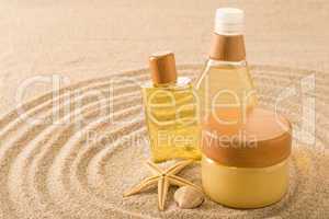 Summer care body product on sand seashell