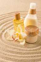 Spa body product on sand orchid flower