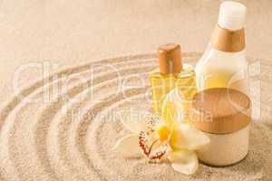Spa body product on sand orchid flower