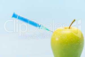 Green apple and syringe genetically modified foods
