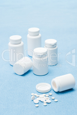 Medicament pills on medical blue background
