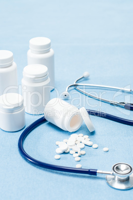 Medical supplies spilled tablets and stethoscope