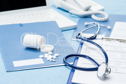 Doctor's office desk with medical accessories