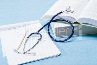 Medical research stethoscope on doctor books