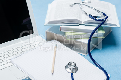 Medical research stethoscope lying on doctor book