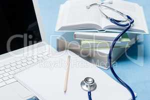 Medical research stethoscope lying on doctor book