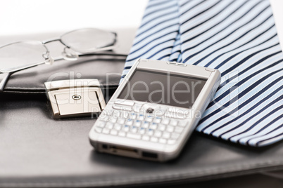 Business mens' accessories tie briefcase phone