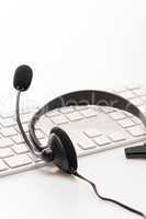 Office headset with microphone keyboard on desk