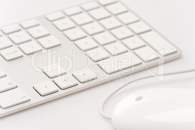 White keyboard with computer mouse