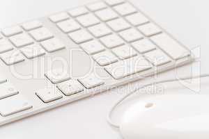 White keyboard with computer mouse
