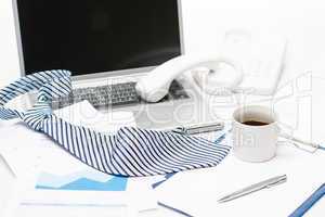 Man's tie laying on business office desk