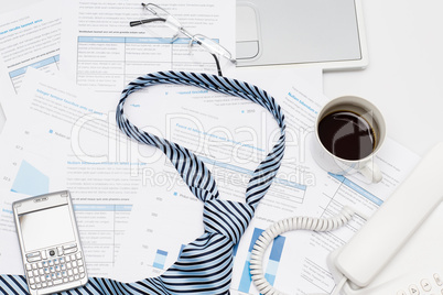 Business tie on busy office desk