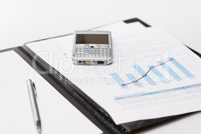 Business growth column chart paper over notepad