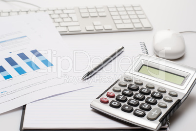 Office desk with supplies calculator pen notepad