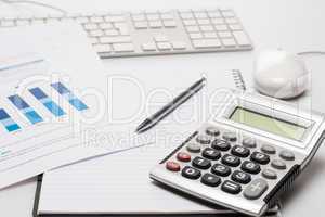 Office desk with supplies calculator pen notepad