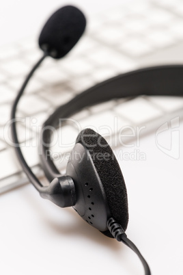 Office headset with microphone keyboard on desk