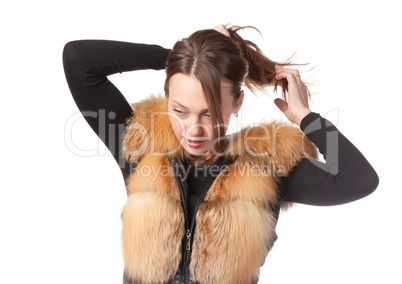 Stylish woman in winter fur jacket