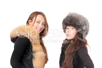 Two attractive women dressed for winter