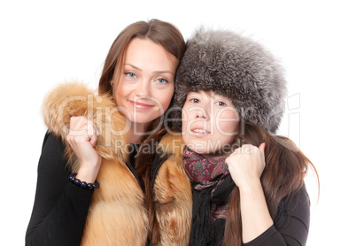 Two attractive women dressed for winter