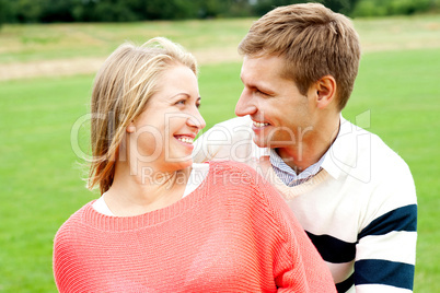 Couple admiring each other and smiling heartily