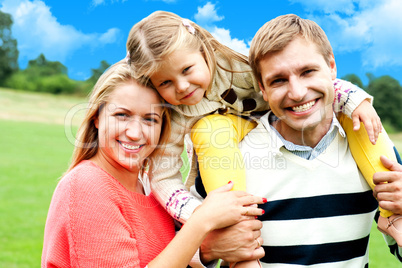 Beautiful happy caucasian family of three