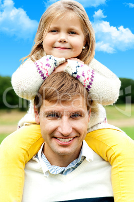 Charming little girl posing with her father